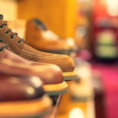Stylish leather boots on a shelf, showcasing craftsmanship in a shoe store.